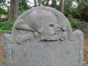 grave stone with skull